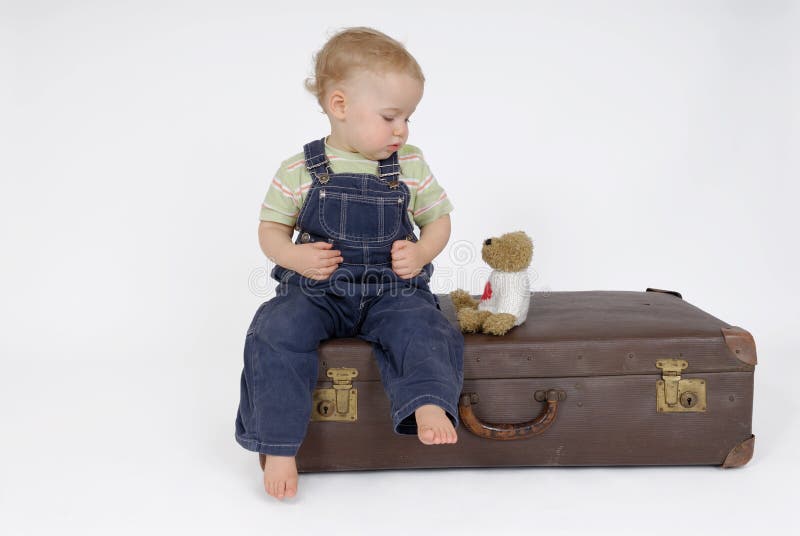 Old suitcase with little child. Old suitcase with little child