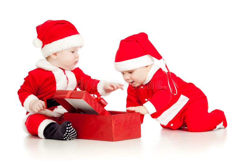 Zwei lustige Kinder in Sankt kleidet mit Geschenkkasten lizenzfreie stockfotografie Zwei lustige Kinder in Sankt kleidet mit Geschenkkasten lizenzfreie stockfotografie