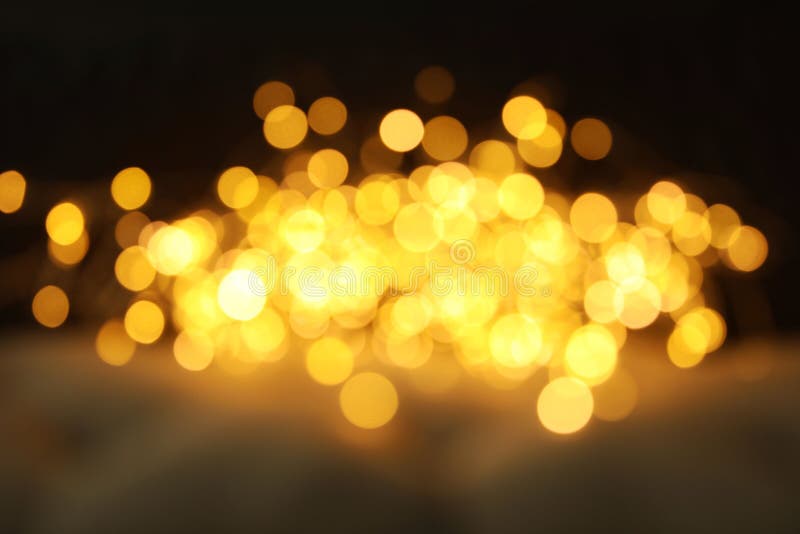 Złocista błyskotliwość z bokeh skutkiem zdjęcie stock