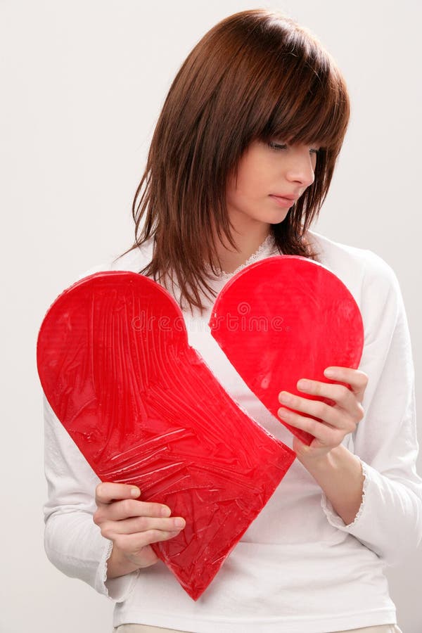 Portrait of young sad woman with broken heart. Portrait of young sad woman with broken heart