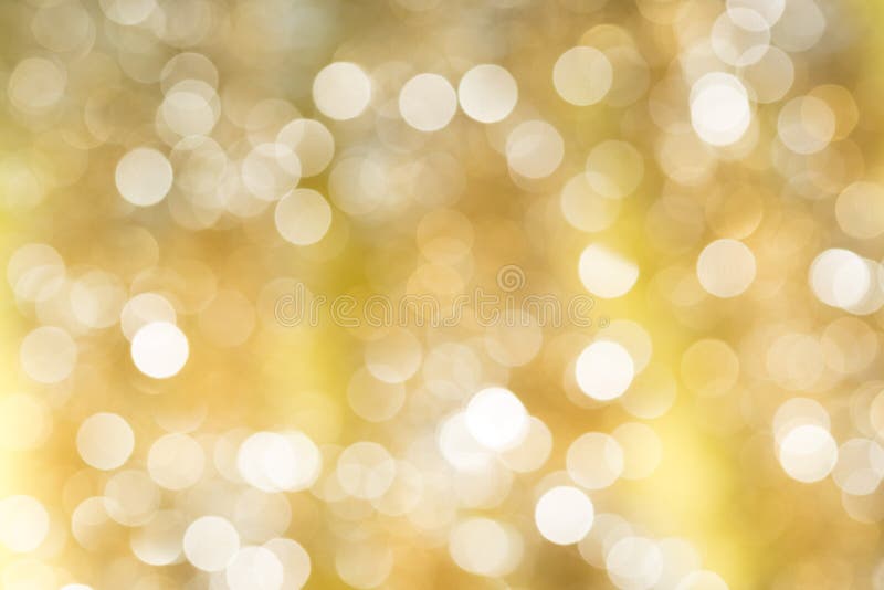 Złocisty zamazany abstrakcjonistyczny bokeh światła backgound zdjęcia stock