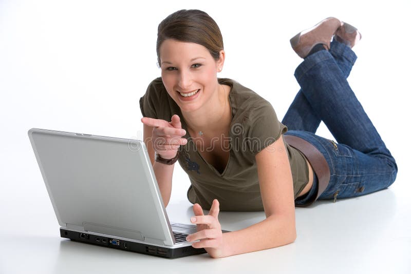 Pretty young woman pointing at her notebook. Pretty young woman pointing at her notebook