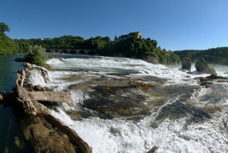 The Rheinfall is found on the border between Switzerland and Germany at Schafffhausen. The two islands can be reached by boat. The falls were at one point in danger of being blasted to make the Rhine navigable up to Lake Constancem, but the scheme was dropped. The Rheinfall is found on the border between Switzerland and Germany at Schafffhausen. The two islands can be reached by boat. The falls were at one point in danger of being blasted to make the Rhine navigable up to Lake Constancem, but the scheme was dropped.