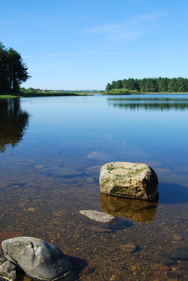 Tranquil photograph showing the clear water of morton reservoir in scotland. Tranquil photograph showing the clear water of morton reservoir in scotland.