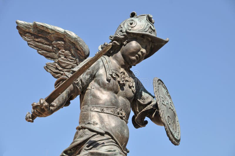 Defensible angel with sword, helmet and shield Statue on Munich's marketplace, Germany. Defensible angel with sword, helmet and shield Statue on Munich's marketplace, Germany