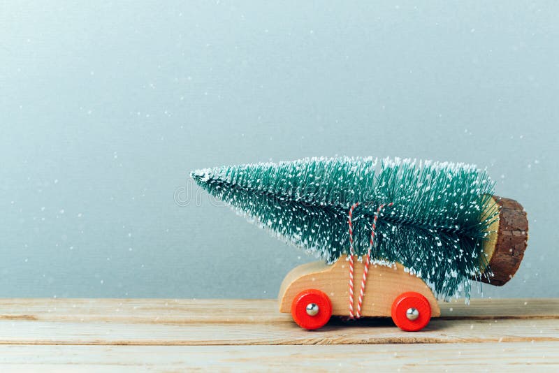 Christmas tree on toy car. Christmas holiday celebration. Christmas tree on toy car. Christmas holiday celebration