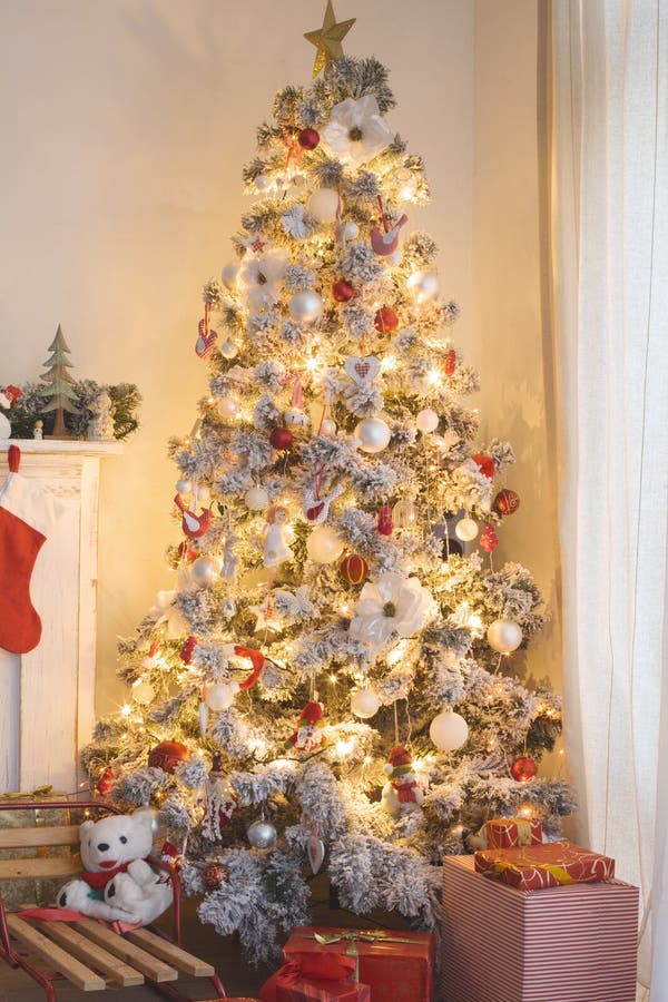 Beautiful holdiay decorated room with Christmas tree with presents under it. Beautiful holdiay decorated room with Christmas tree with presents under it