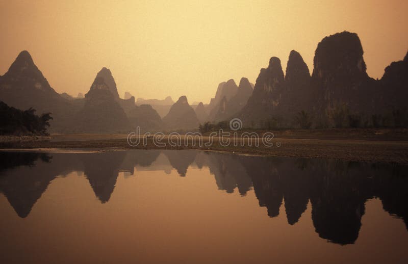 The landscape at the Li River near Yangshou near the city of Guilin in the Province of Guangxi in china in east asia. The landscape at the Li River near Yangshou near the city of Guilin in the Province of Guangxi in china in east asia.