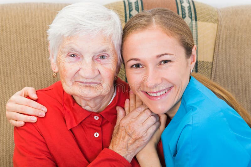 Photo of elderly women with the young carer. Photo of elderly women with the young carer