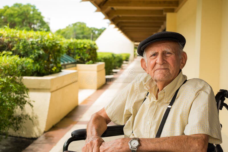 Elderly 80 plus year old man in a wheel chair outdoors. Elderly 80 plus year old man in a wheel chair outdoors.