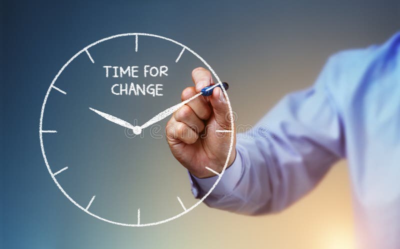 Businessman hand drawing a clock on whiteboard with time for change concept for planning, improvement and progress. Businessman hand drawing a clock on whiteboard with time for change concept for planning, improvement and progress