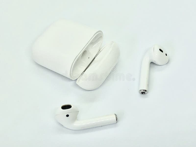 Apple AirPods, white wireless ear buds with charging case on the white background. Apple AirPods, white wireless ear buds with charging case on the white background.