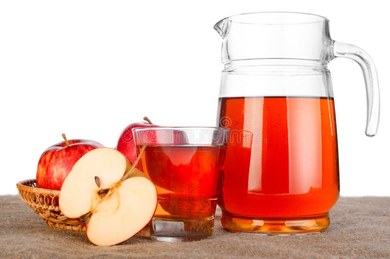 Apple juice. Fresh ripe apples and glass jar of juice on table with linen tablecloth over white background. Apple juice. Fresh ripe apples and glass jar of juice on table with linen tablecloth over white background