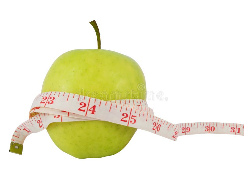 Diet concept with a green apple and a measure tape in inches (model waist measure length in tape). Diet concept with a green apple and a measure tape in inches (model waist measure length in tape)