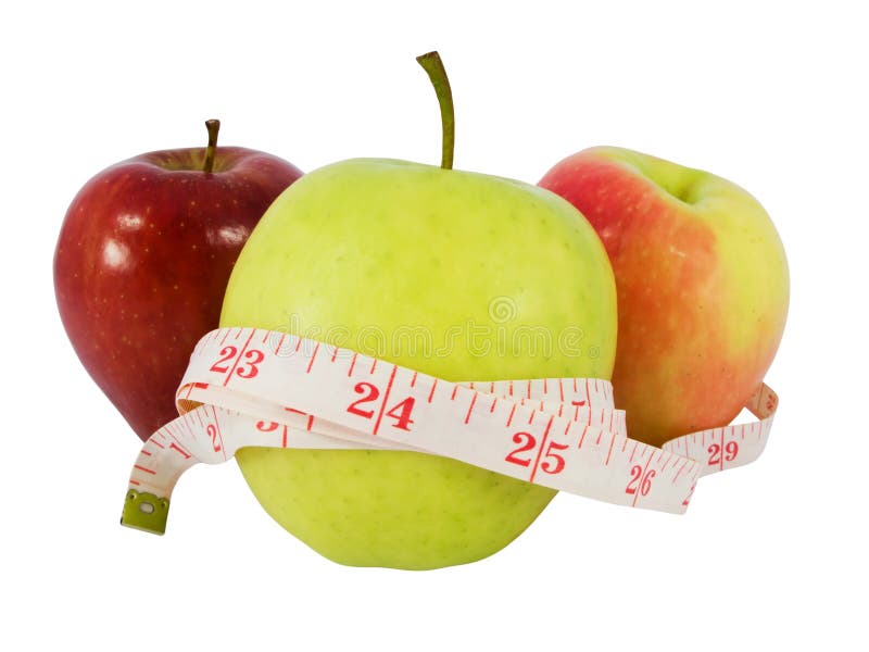 Diet concept with a green apple and a measure tape in inches (model waist measure length in tape). Diet concept with a green apple and a measure tape in inches (model waist measure length in tape)