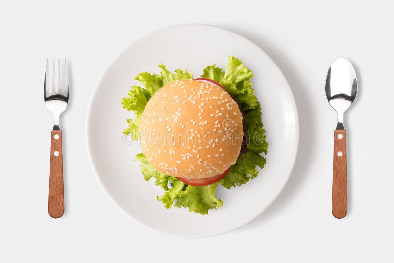 Äta bbq-hamburgaren på maträtten som isoleras på vit bakgrund clipping arkivfoto Äta bbq-hamburgaren på maträtten som isoleras på vit bakgrund clipping arkivfoto