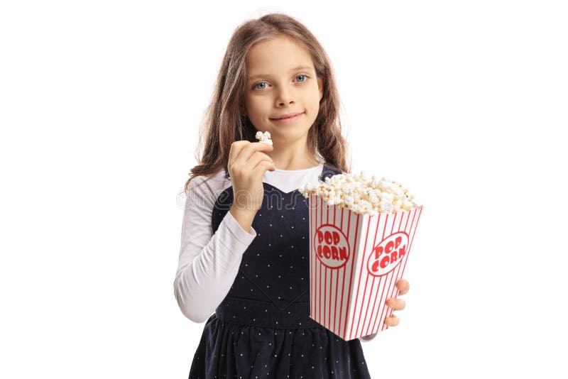 Little girl eating popcorn isolated on white background. Little girl eating popcorn isolated on white background