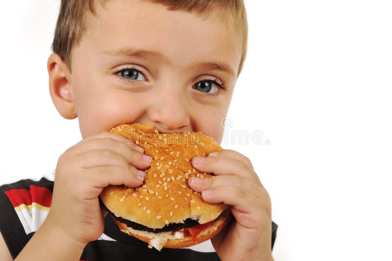 Boy eating burger on white background. Boy eating burger on white background