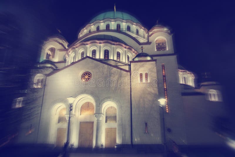 Saint Sava Church in Belgrade, the largest Orthoodx church in the world and one of the major landmarks of Belgrade, in the evening. Image filtered in faded, soft, blurry, dreamy, retro style with radial blur. Saint Sava Church in Belgrade, the largest Orthoodx church in the world and one of the major landmarks of Belgrade, in the evening. Image filtered in faded, soft, blurry, dreamy, retro style with radial blur.