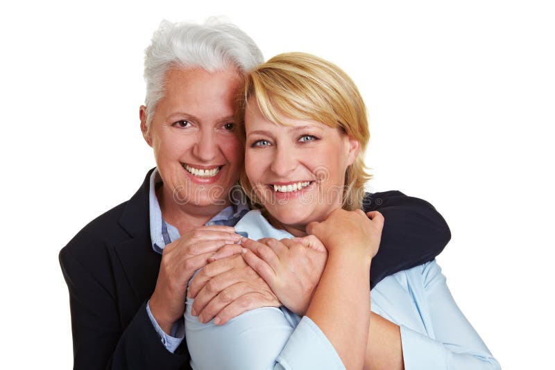 åldring som omfamnar två kvinnor arkivfoto åldring som omfamnar två kvinnor arkivfoto