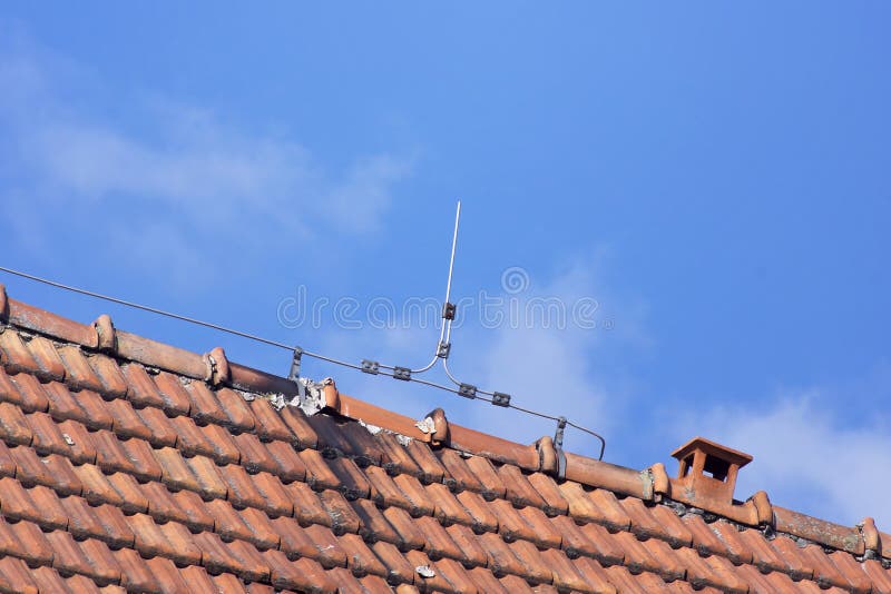 Lightning rod wire on the roof of clay tiles. Lightning rod wire on the roof of clay tiles