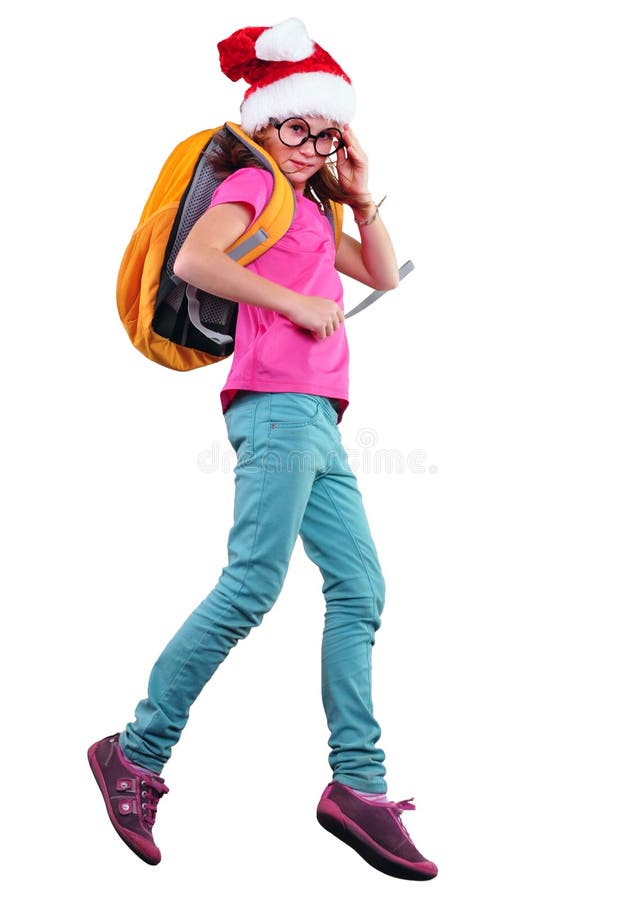 Écolière ou voyageur de Noël heureux s'exerçant, courant et sautant image stock Écolière ou voyageur de Noël heureux s'exerçant, courant et sautant image stock