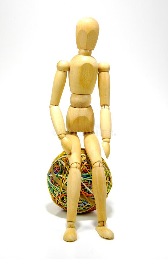 Mannequin Sitting on a Rubberband Ball. Mannequin Sitting on a Rubberband Ball.