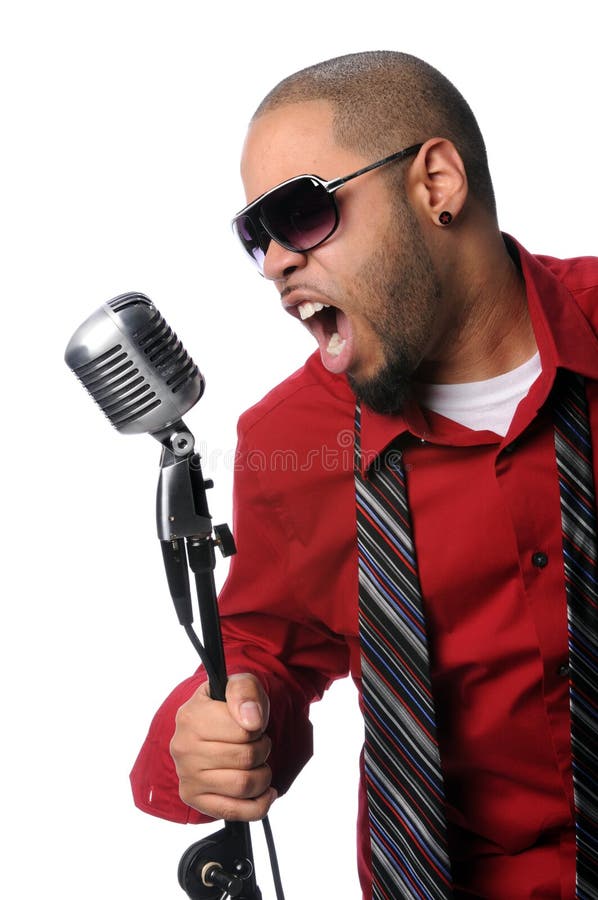 African American singer singing into vintage microphone. African American singer singing into vintage microphone