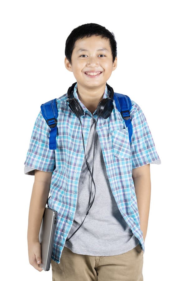 Étudiant de la préadolescence bel souriant à l'appareil-photo photographie stock libre de droits Étudiant de la préadolescence bel souriant à l'appareil-photo photographie stock libre de droits