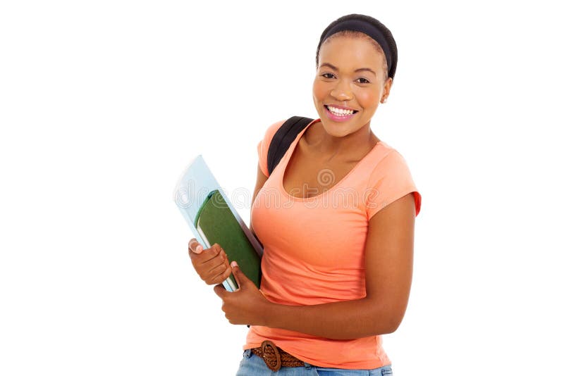 Étudiant universitaire féminin d'afro-américain tenant des livres photographie stock Étudiant universitaire féminin d'afro-américain tenant des livres photographie stock