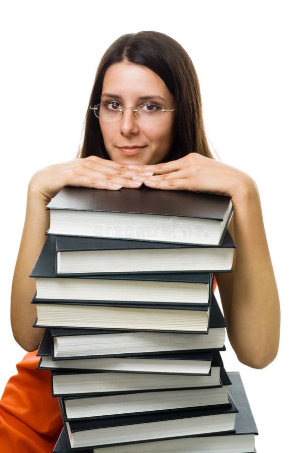 Étudiante intelligente sur la pile des livres images stock Étudiante intelligente sur la pile des livres images stock