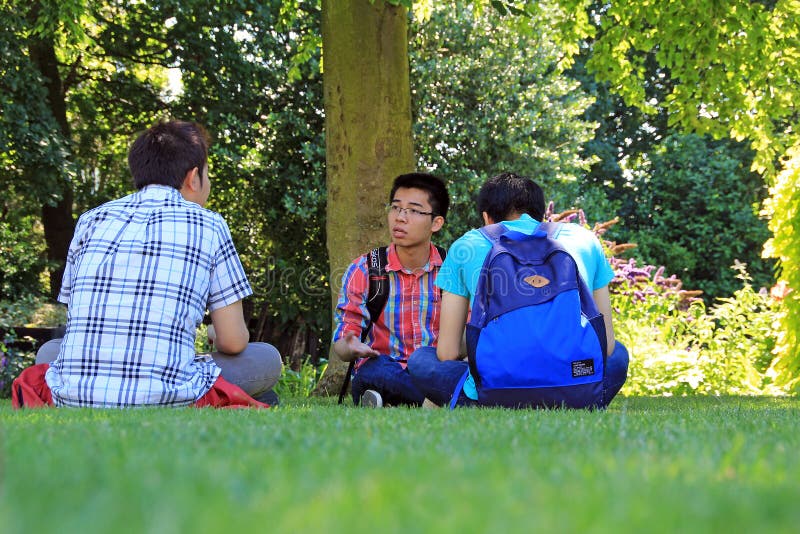 Photo of chinese college students taking a break on campus grounds photo taken 3rd july 2014 and ideal for teen friends, college students etc. Photo of chinese college students taking a break on campus grounds photo taken 3rd july 2014 and ideal for teen friends, college students etc.