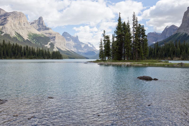 Spirit Island is a world-known tiny island in Maligne Lake in Jasper National Park, Alberta, Canada. Spirit Island is a world-known tiny island in Maligne Lake in Jasper National Park, Alberta, Canada