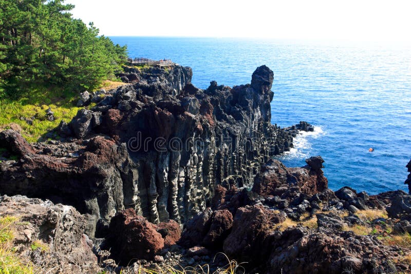 Volcanic rock joint rising out of the ocean. Volcanic rock joint rising out of the ocean