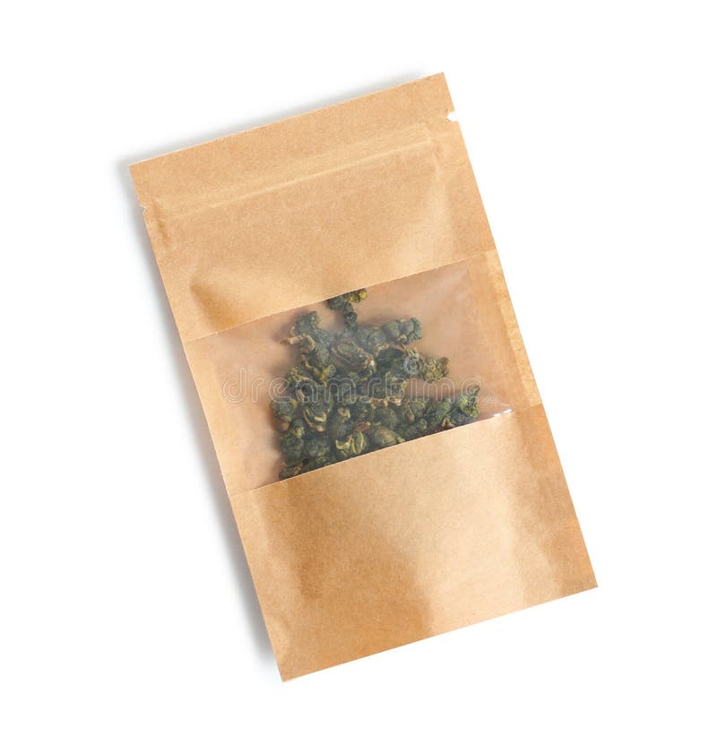 Τσάντα εγγράφου τεχνών με το τσάι Guan Yin Oolong δεσμών στο άσπρο υπόβαθρο στοκ φωτογραφία με δικαίωμα ελεύθερης χρήσης Τσάντα εγγράφου τεχνών με το τσάι Guan Yin Oolong δεσμών στο άσπρο υπόβαθρο στοκ φωτογραφία με δικαίωμα ελεύθερης χρήσης
