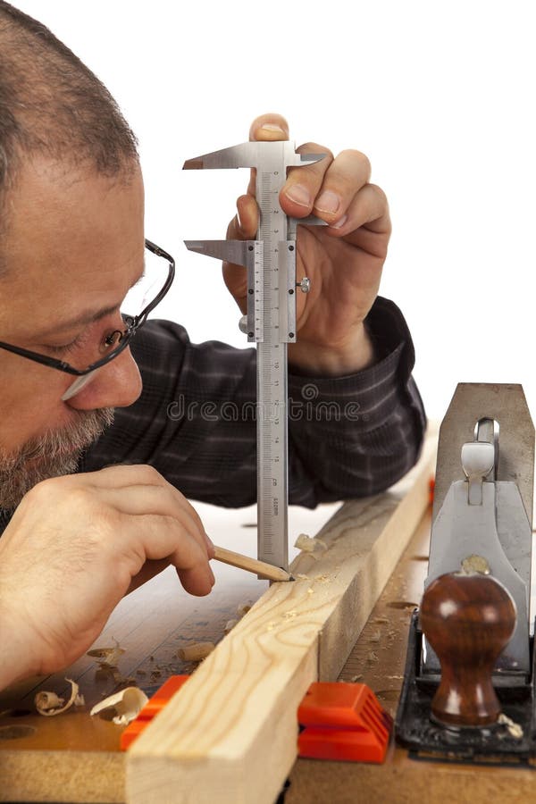Ð¡arpenter with calipers. stock photo