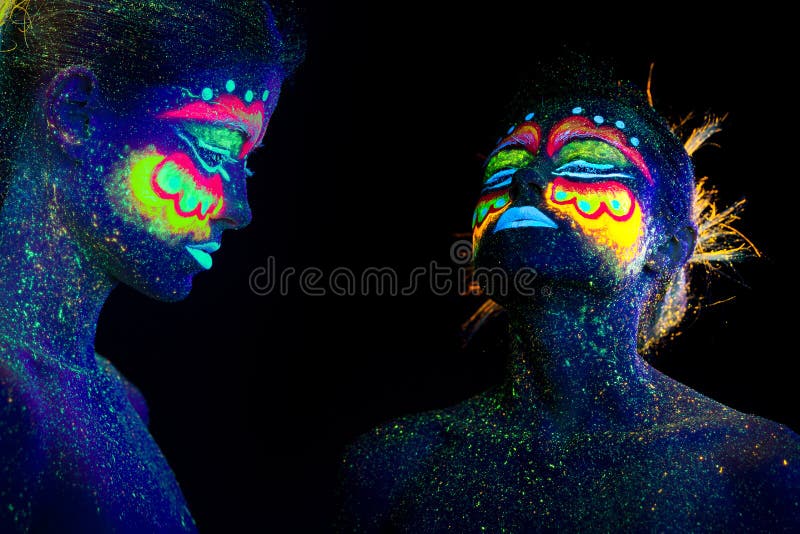 Portrait of a girl with ultraviolet make-up profile and raised head. stock photo Portrait of a girl with ultraviolet make-up profile and raised head. stock photo