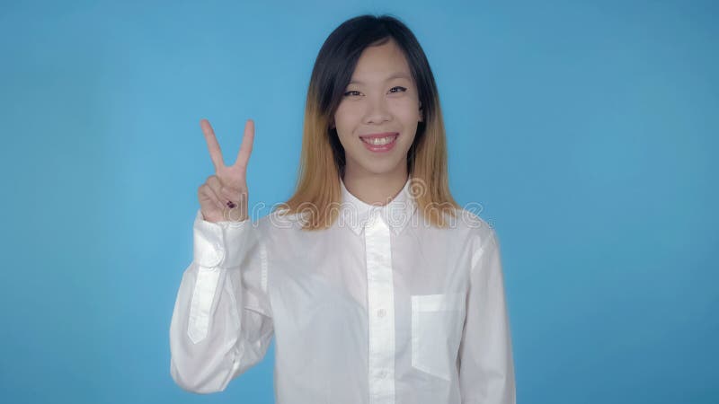 Красивый корейский женский выигрыш знака выставок стоковое изображение Красивый корейский женский выигрыш знака выставок стоковое изображение