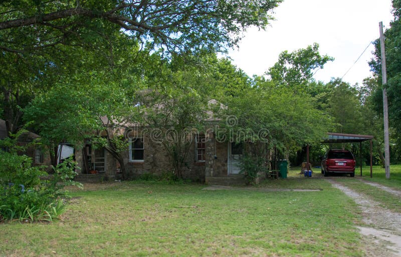 Modern American rural life in Texas. Old poor cottage and garden royalty free stock images Modern American rural life in Texas. Old poor cottage and garden royalty free stock images