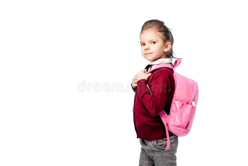 Ребенок с schoolbag Девушка в белой рубашке и серых брюках, держит сумку школы и представлять как модель Изолировано на белизне стоковая фотография rf Ребенок с schoolbag Девушка в белой рубашке и серых брюках, держит сумку школы и представлять как модель Изолировано на белизне стоковая фотография rf