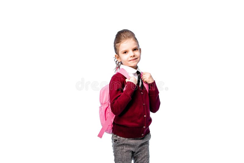 Ребенок с schoolbag Девушка в белой рубашке и серых брюках, держит сумку школы и представлять как модель Изолировано на белизне стоковая фотография rf Ребенок с schoolbag Девушка в белой рубашке и серых брюках, держит сумку школы и представлять как модель Изолировано на белизне стоковая фотография rf