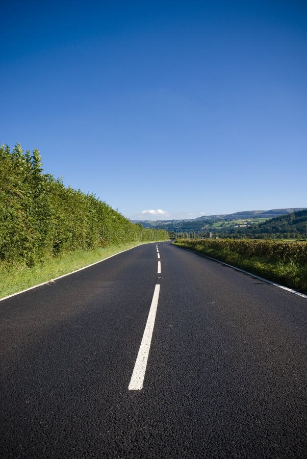 Inviting road heading to picturesque horizon. Inviting road heading to picturesque horizon.