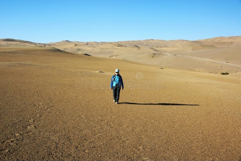 Was taken in dunhuang of china, a girl walk in desert. Was taken in dunhuang of china, a girl walk in desert
