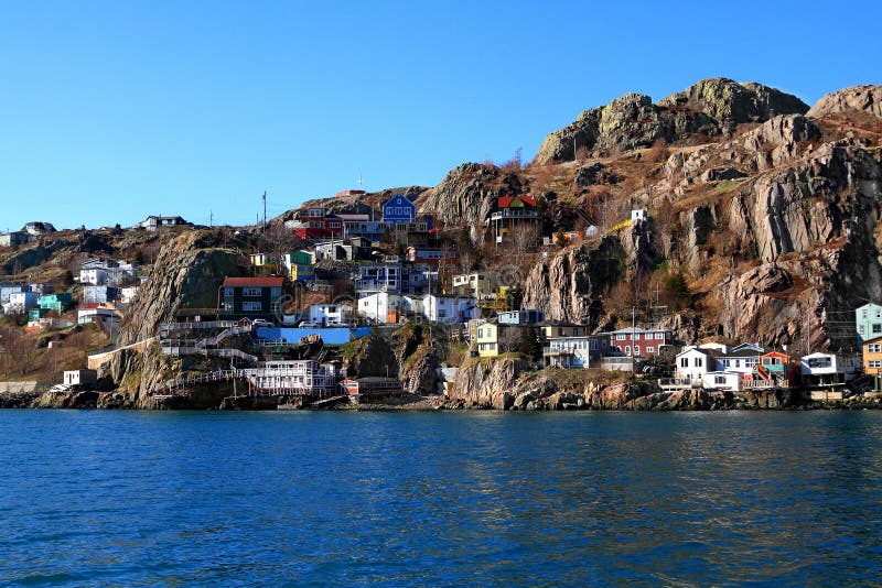 From the Atlantic Ocean level View over Newfoundland Capital St.Johns Houses on East end which are reaching the foot steps of million years old rock of Signal Hill. From the Atlantic Ocean level View over Newfoundland Capital St.Johns Houses on East end which are reaching the foot steps of million years old rock of Signal Hill