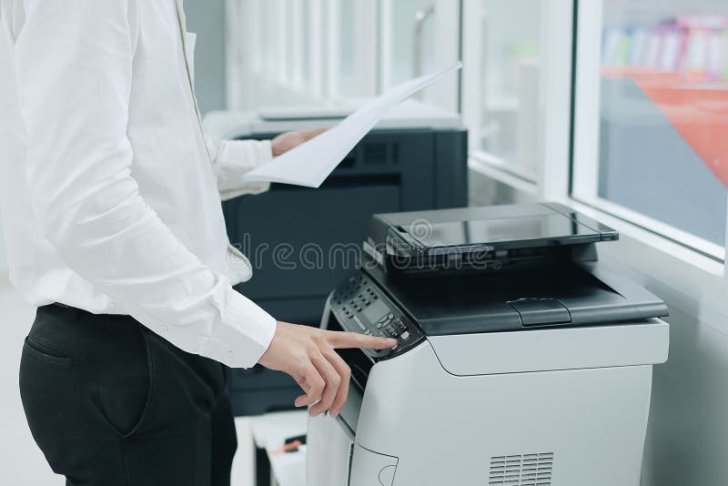 Bussiness man Hand press button on panel of printer scanner or laser copy machine in office. Bussiness man Hand press button on panel of printer scanner or laser copy machine in office