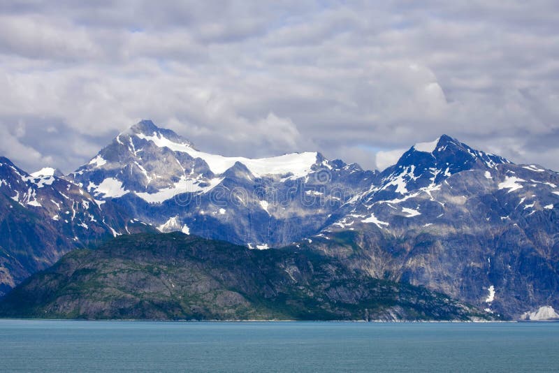 Alaska, American, bay, blue, calving, clouds, cold, colors, debris, glacier, ice, melting, mountains, nature, ocean, scenic, sea, sky, sliding, snow, summer, thaw, valley, warming, reflection, sunset, sunrise, USA, travel. Alaska, American, bay, blue, calving, clouds, cold, colors, debris, glacier, ice, melting, mountains, nature, ocean, scenic, sea, sky, sliding, snow, summer, thaw, valley, warming, reflection, sunset, sunrise, USA, travel