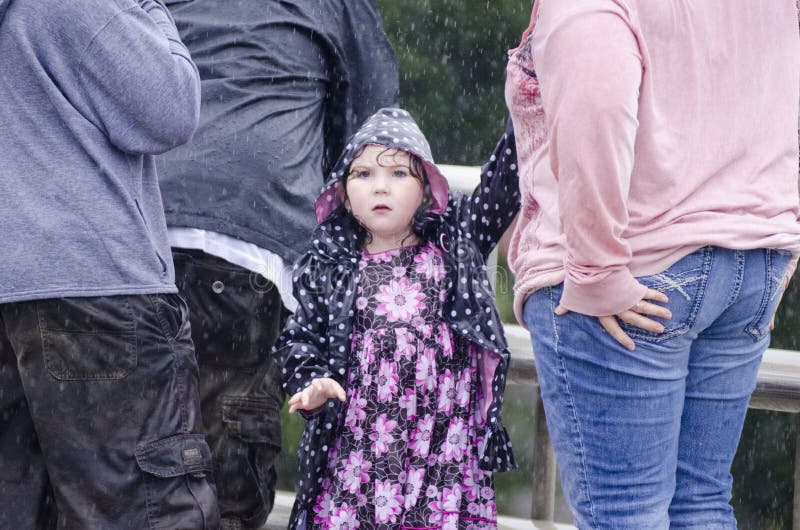 A little girl tries to get her mothers attention as she sees a massive clump of debris heading for the bridge they are standing on as waters in Barre Vermont began to rise and flood low lying areas in the tiny Vermont town. A little girl tries to get her mothers attention as she sees a massive clump of debris heading for the bridge they are standing on as waters in Barre Vermont began to rise and flood low lying areas in the tiny Vermont town.