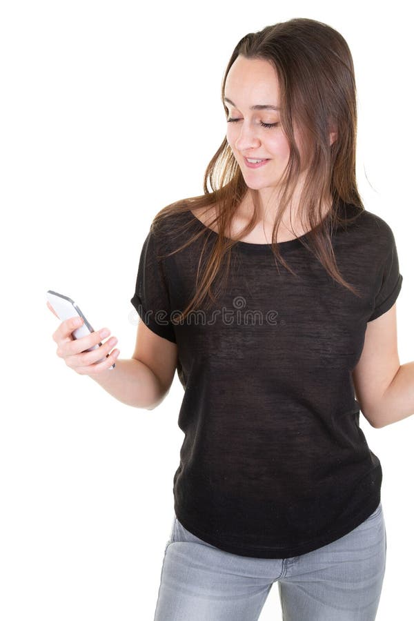 Ładna szczupła młoda kobieta ono uśmiecha się z Mobil telefonem przeciw białemu tłu fotografia royalty free Ładna szczupła młoda kobieta ono uśmiecha się z Mobil telefonem przeciw białemu tłu fotografia royalty free