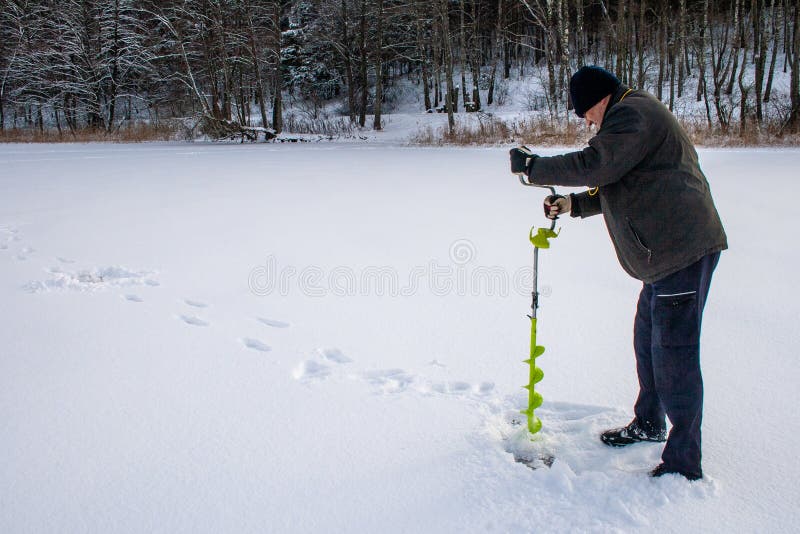 Small hand operated ice auger used in ice fishing, hand fishing ice drill. Small hand operated ice auger used in ice fishing, hand fishing ice drill