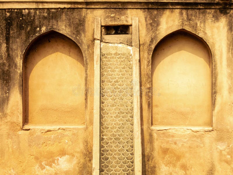 Arched niches on the walls of the ancient Mughal era tombs in the city of Prayagraj in India. Arched niches on the walls of the ancient Mughal era tombs in the city of Prayagraj in India